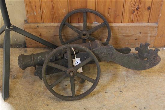 A late 19th / early 20th century cast iron cannon, 18.5in. (length of barrel), overall 26.5in.